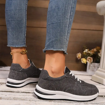 Woman wearing Indigo denim casual sneakers paired with jeans, showcasing flexible design and comfort for daily wear.