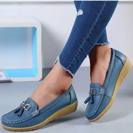 Blue women's moccasin-style sneakers for elegance and comfort, featuring a synthetic leather finish and metallic detail.
