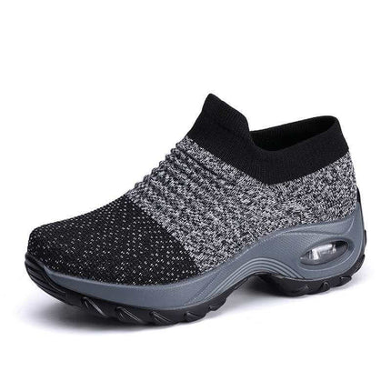 Zapatillas transpirables deportivas negras con amortiguador, diseño ligero y flexible, ideales para trabajo y caminatas largas.