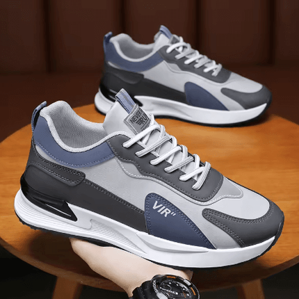 Zapatillas deportivas Urban Flow Hombre en gris y azul, diseño moderno y confortable, ideales para estilo urbano.