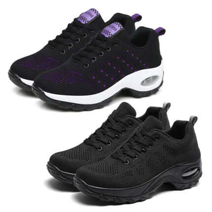 Two pairs of Zapatillas Urban Trek Zenithi sneakers in black and purple, showcasing comfort and flexibility for fitness activities.