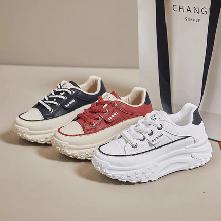 Modern chunky sole sneakers in navy, red, and white, offering comfort, style, and versatility for a casual yet trendy look.