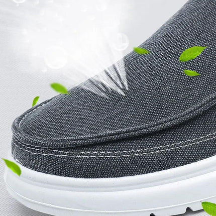 Zapatos de lona casual para hombre en gris con diseño transpirable, ideales para caminar y estilo moderno.