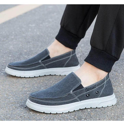 Zapatos de lona casuales para hombre, perfectos para caminar, en color gris, mostrando estilo cómodo y moderno.