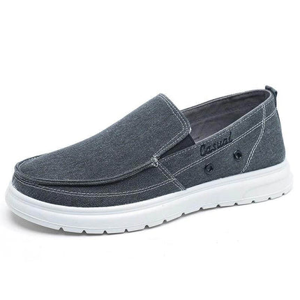 Zapatos de lona casuales para hombre en color gris con suela blanca, perfectos para caminar y estilo informal. Talle disponible en Argentina.