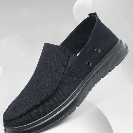 Zapato de lona casual negro para hombre, diseño cómodo y moderno, ideal para paseos. Tamaños variados disponibles.