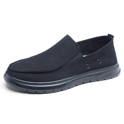 Zapatos casuales de lona negra para hombre, ideales para caminar, estilo informal moderno.