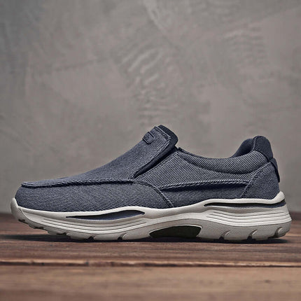 Zapatos de lona sin cordones azul para hombre con suela antideslizante, ideales para un estilo casual y cómodo.