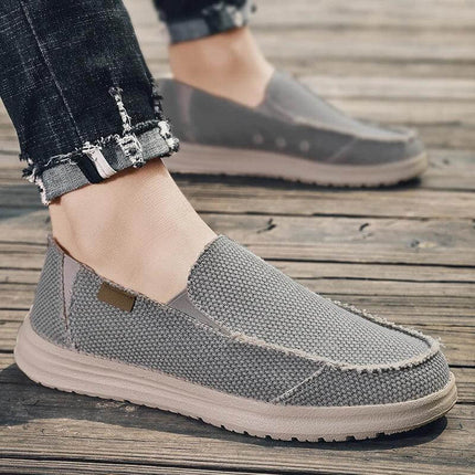 Zapatos informales transpirables de lona gris para hombre, ideales para un estilo casual y cómodo. "Zapatos Casuales Hombre" en Argentina.