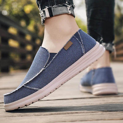 Zapatos informales transpirables de lona para hombre en color azul, ideales para un look casual y cómodo.