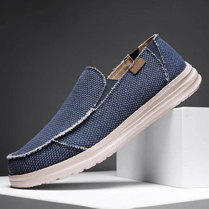 Zapatos casuales hombre de lona transpirables en azul, ideales para estilo informal y confort.