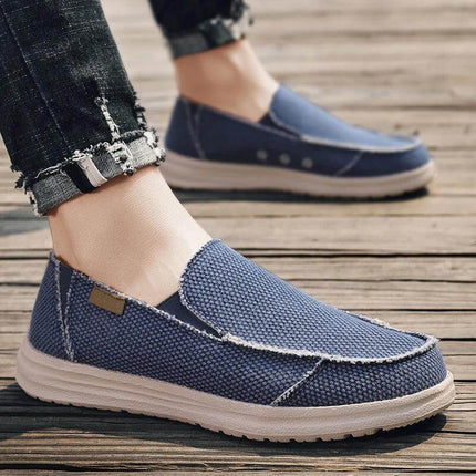 Zapatos casuales hombre de lona azul, diseño transpirable y cómodo, ideales para uso diario.