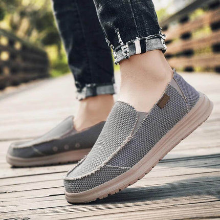 Zapatos casuales transpirables de lona para hombre, estilo moderno en un paseo al aire libre.